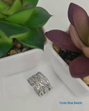 Criss cross adjustable ring